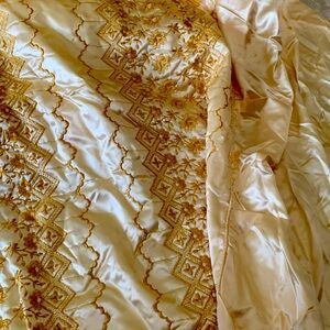 Beautiful  golden color embroidered bed spread.